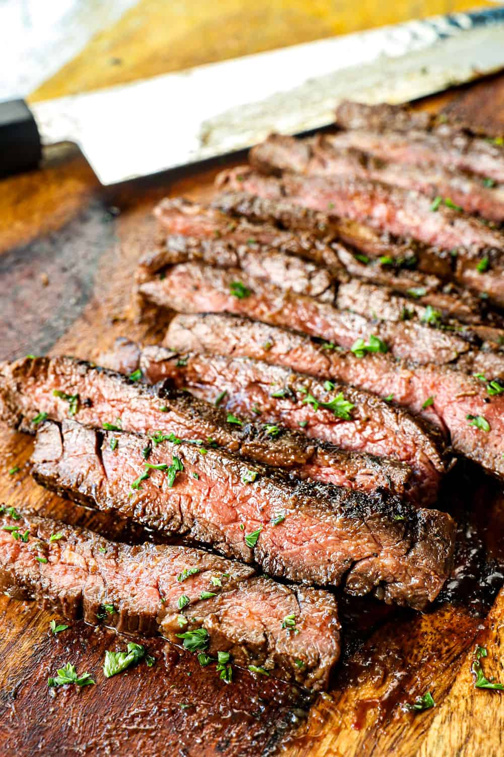 marinated skirt steak recipe sliced on the cutting board showing how juicy and tender it is