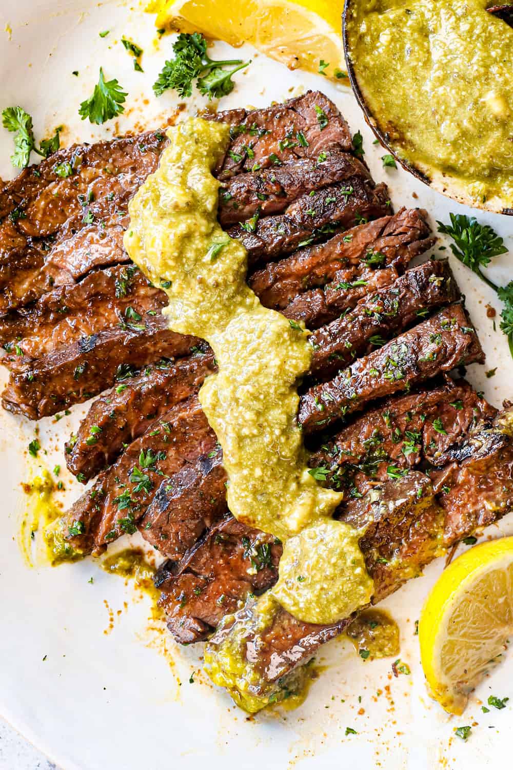 top view of marinated skirt steak recipe being served on a plate