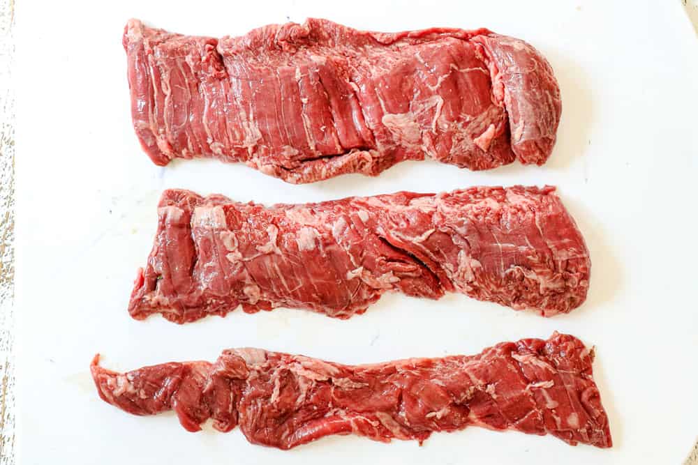 showing how to cook skirt steak recipe by slicing the steak into three sections