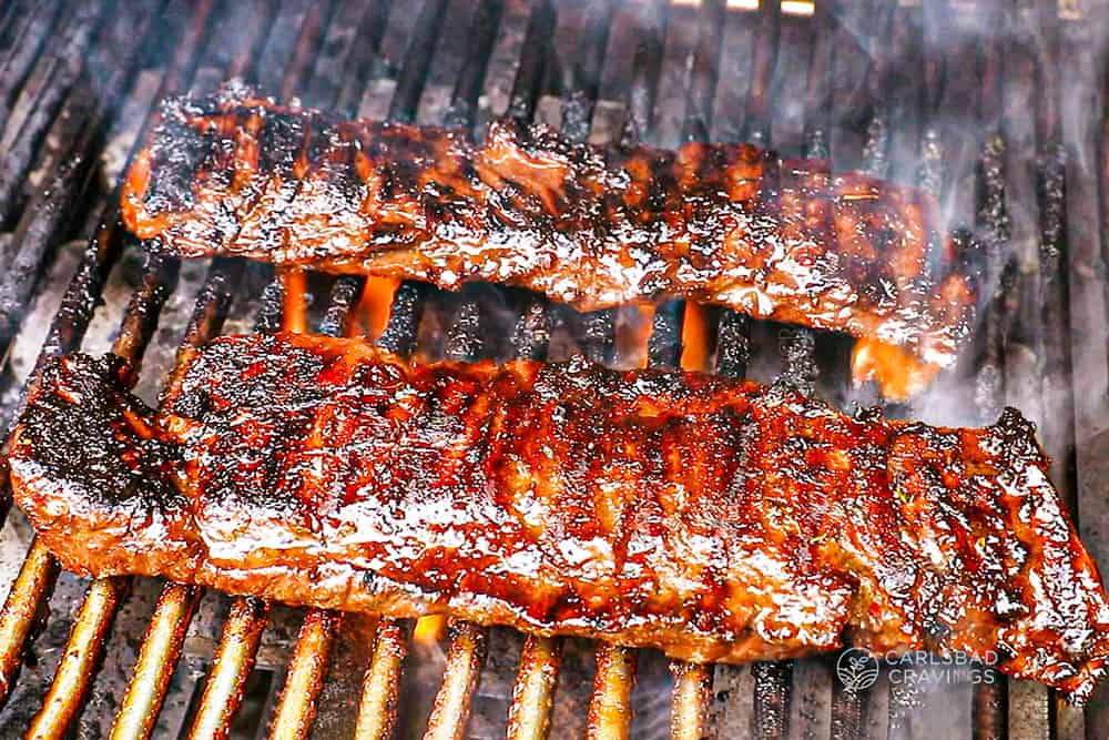 showing how to cook skirt steak by grilling the steaks over high heat on a gas grill