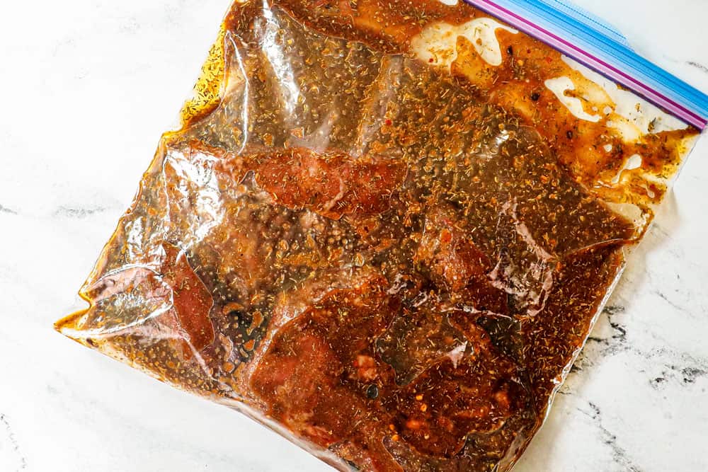 showing how to make skirt steak by adding steak to a freezer bag with marinade