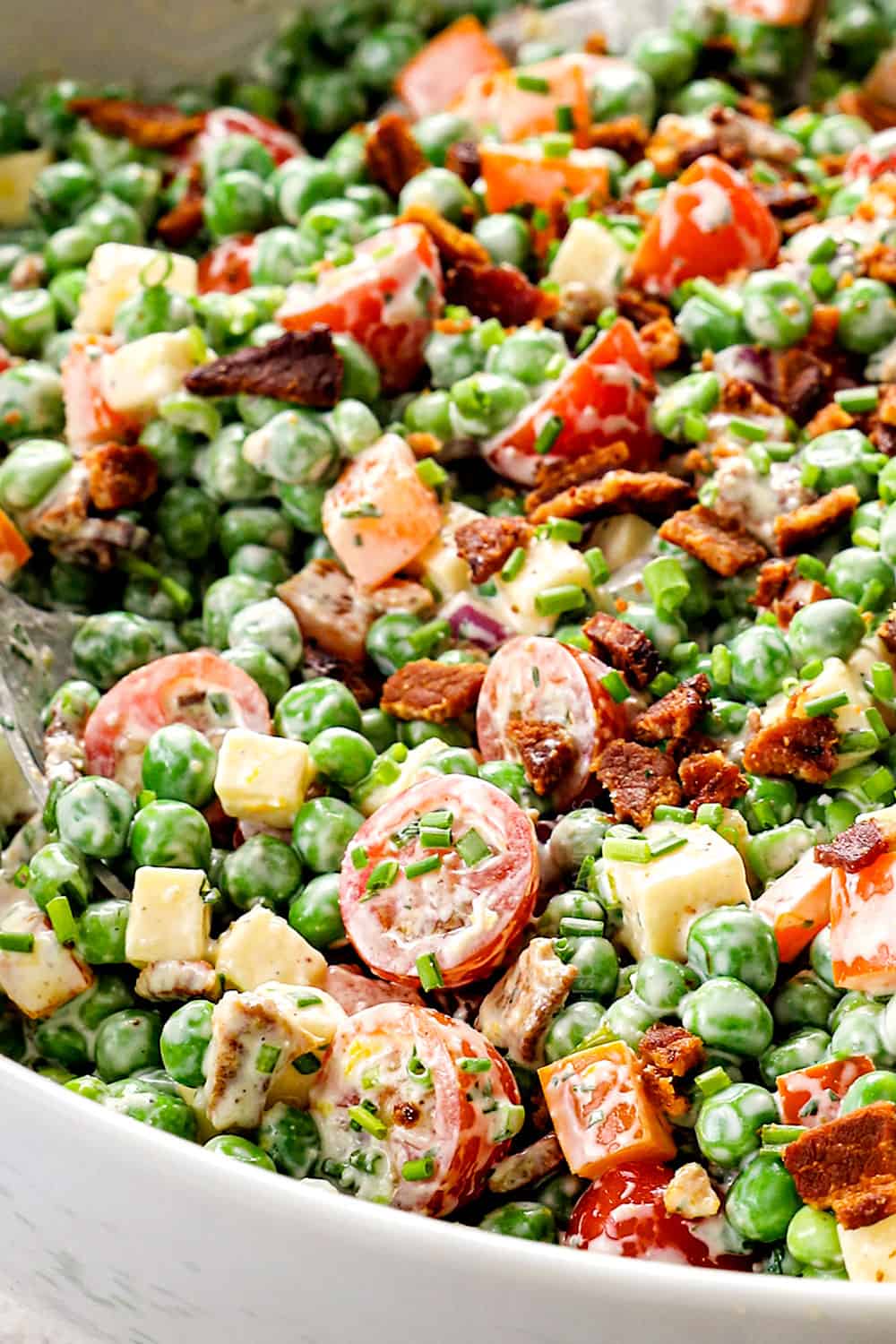 up close of pea salad showing how creamy the dressing is