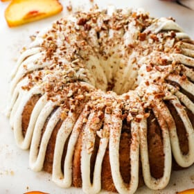 a peach pound cake drizzled with frosting