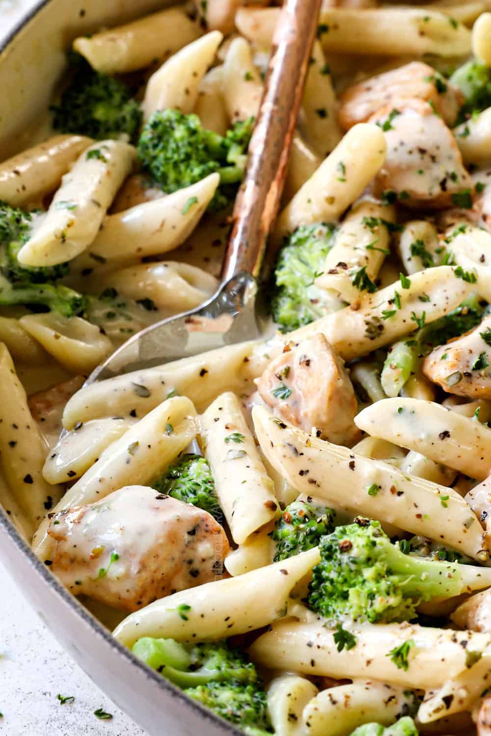 up close of serving chicken broccoli Alfredo recipe showing how creamy it is