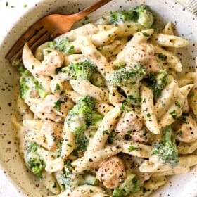 serving broccoli chicken alfredo in a bowl showing how creamy it is