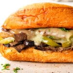 up close of Crockpot Philly Cheesesteak recipe showing how juicy the beef is