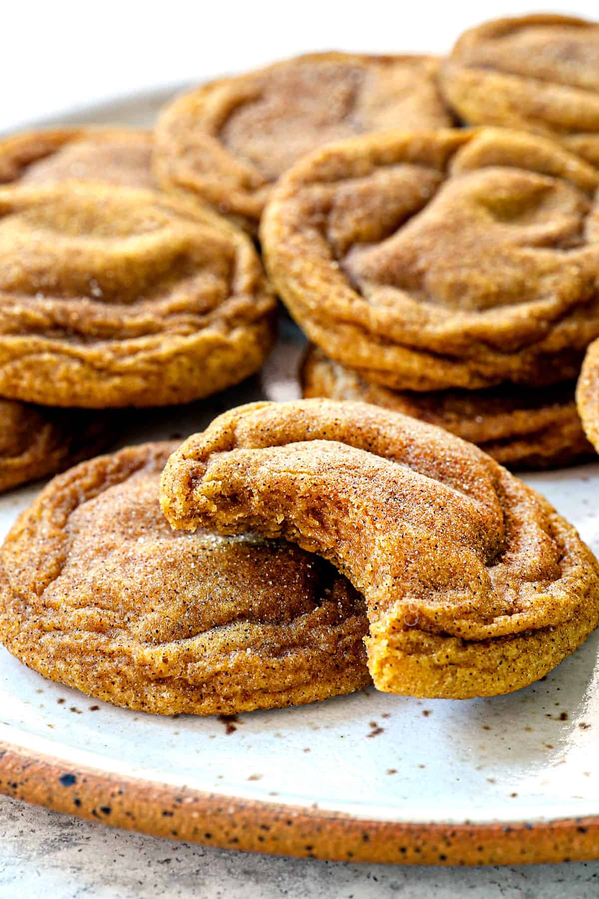 up close of pumpkin snickerdoodles with a bite taken out
