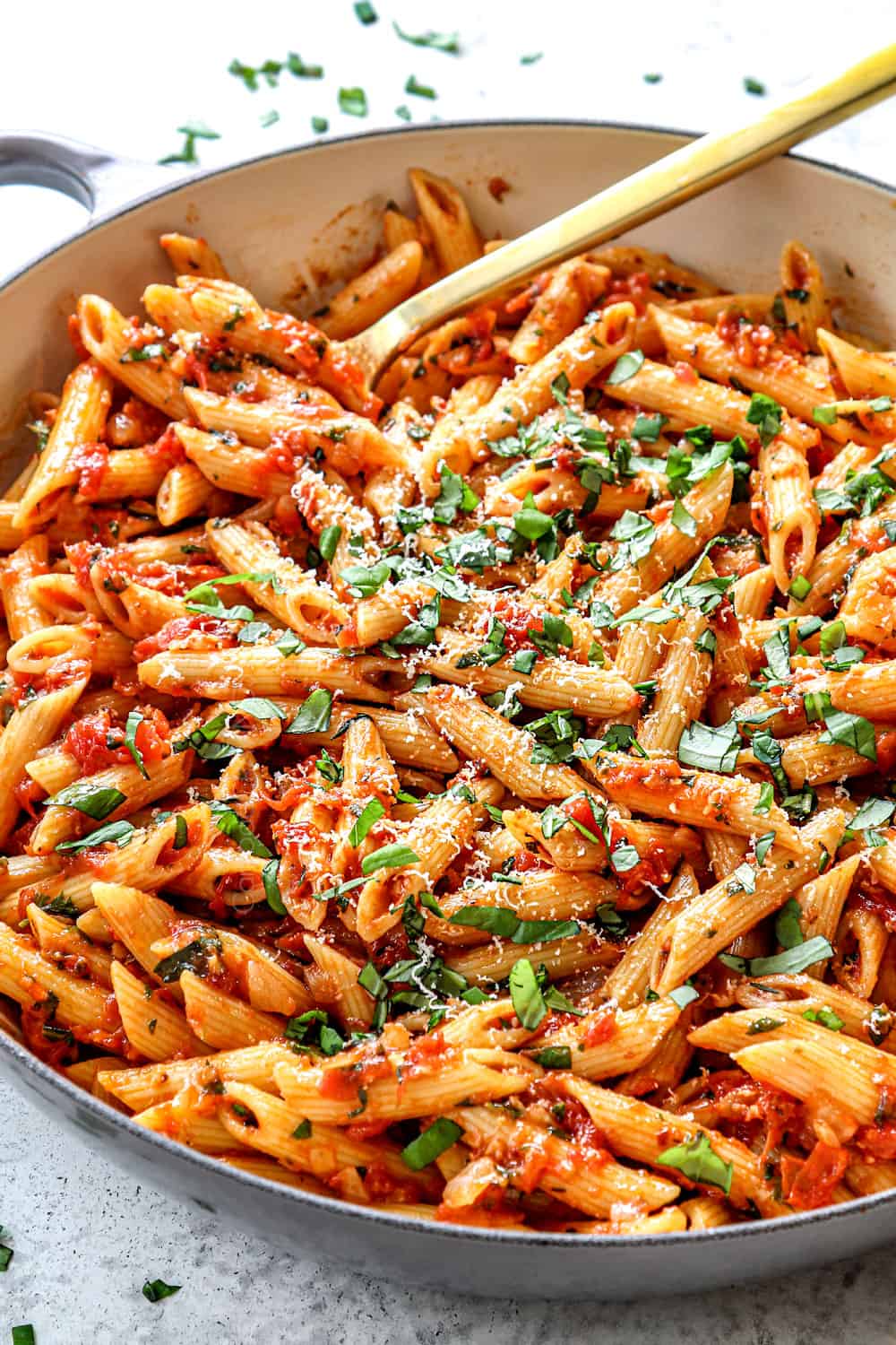 Arrabbiata sauce tossed with penne in a saucepan