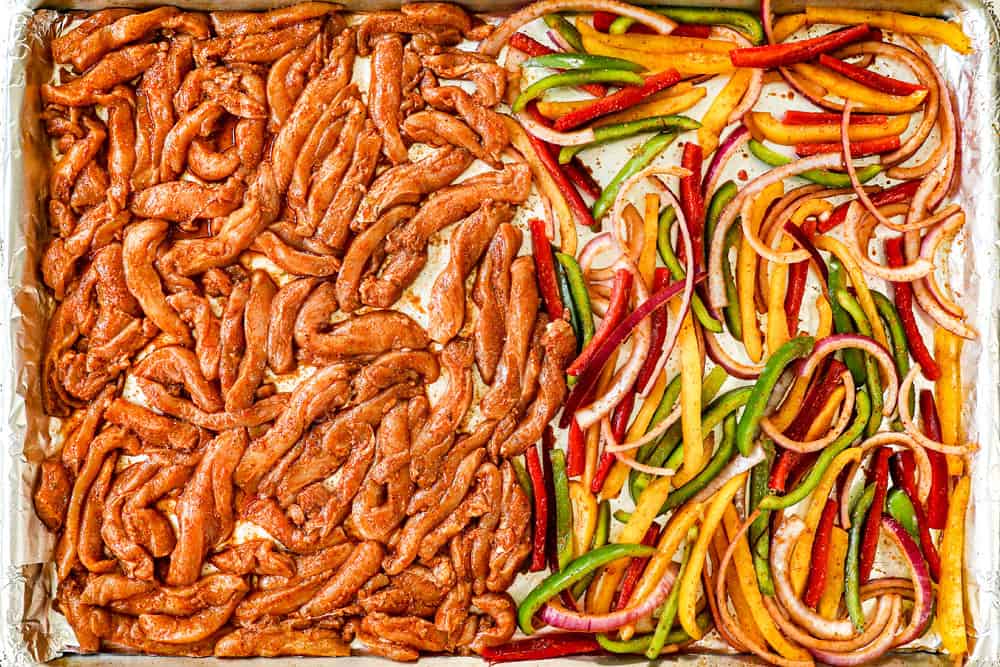 showing how to make sheet pan chicken fajitas by spreading chicken strips and bell peppers on a baking sheet
