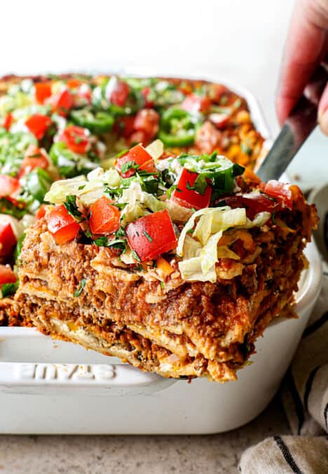 up close of a serving a slice of taco lasagna showing all the layers