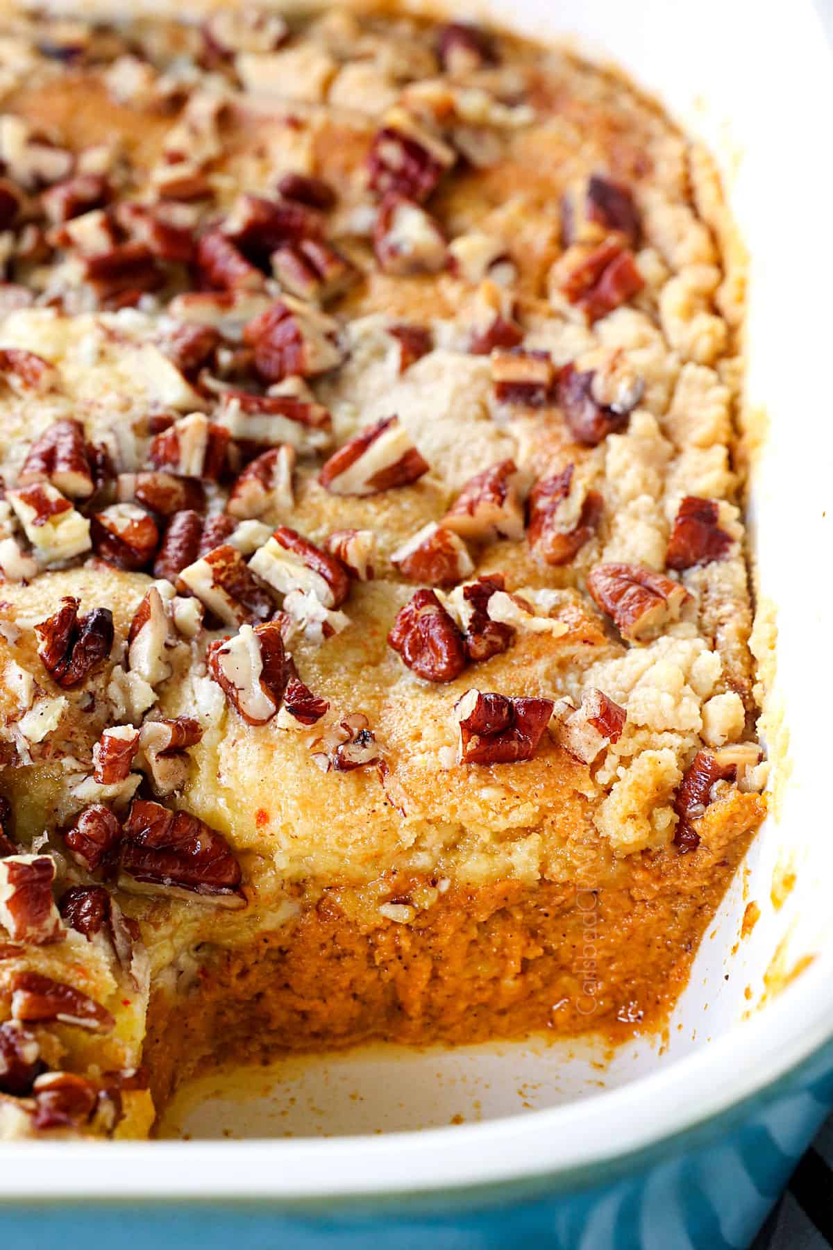 up closer of a slice missing of dump pumpkin cake showing how creamy the filling is