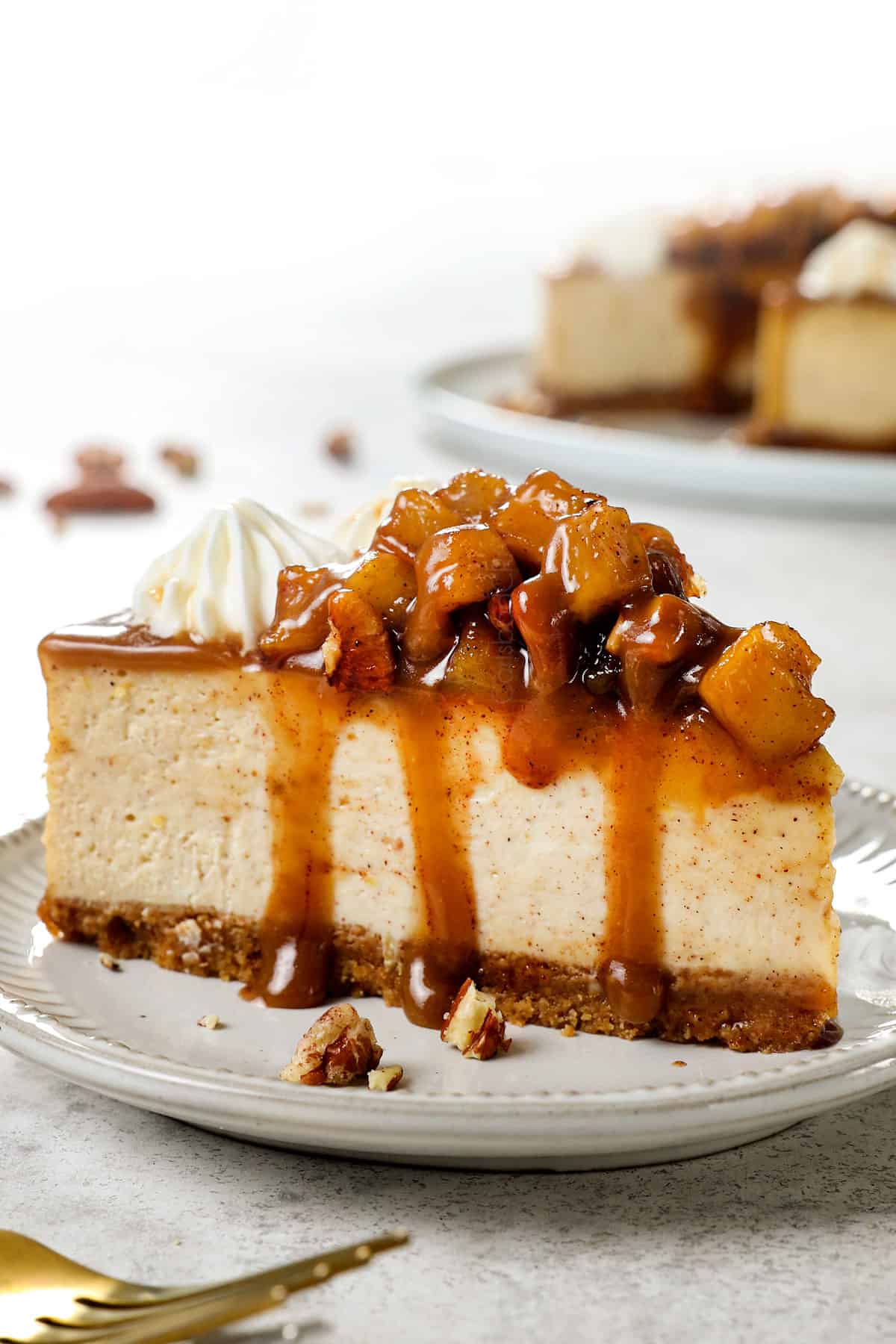a slice of easy caramel apple cheesecake recipe drizzled with caramel
