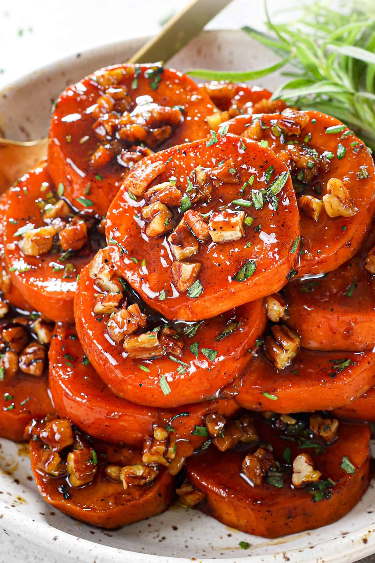 up close of best ever candied yams (candied sweet potatoes) recipe with pecans