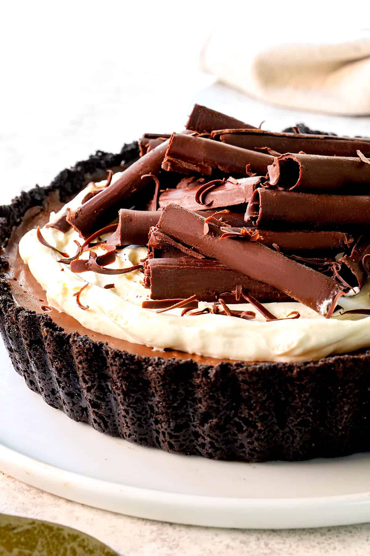 up close side view of classic chocolate cream pie recipe with an Oreo crust