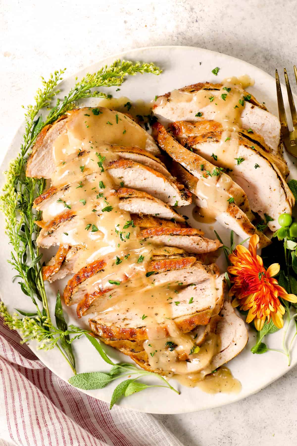 top view of roasted turkey breast sliced with gravy