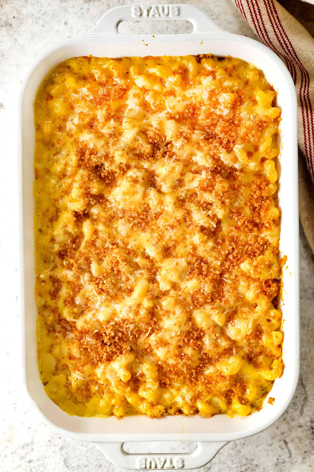 showing how to make Baked Macaroni and Cheese recipe with bread crumbs by baking until the cheese is melted