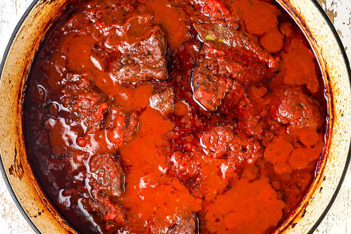 showing how to make ragu recipe by simmering beef until tender