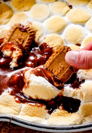 a skillet of s'mores dip made in the oven with melted chocolate