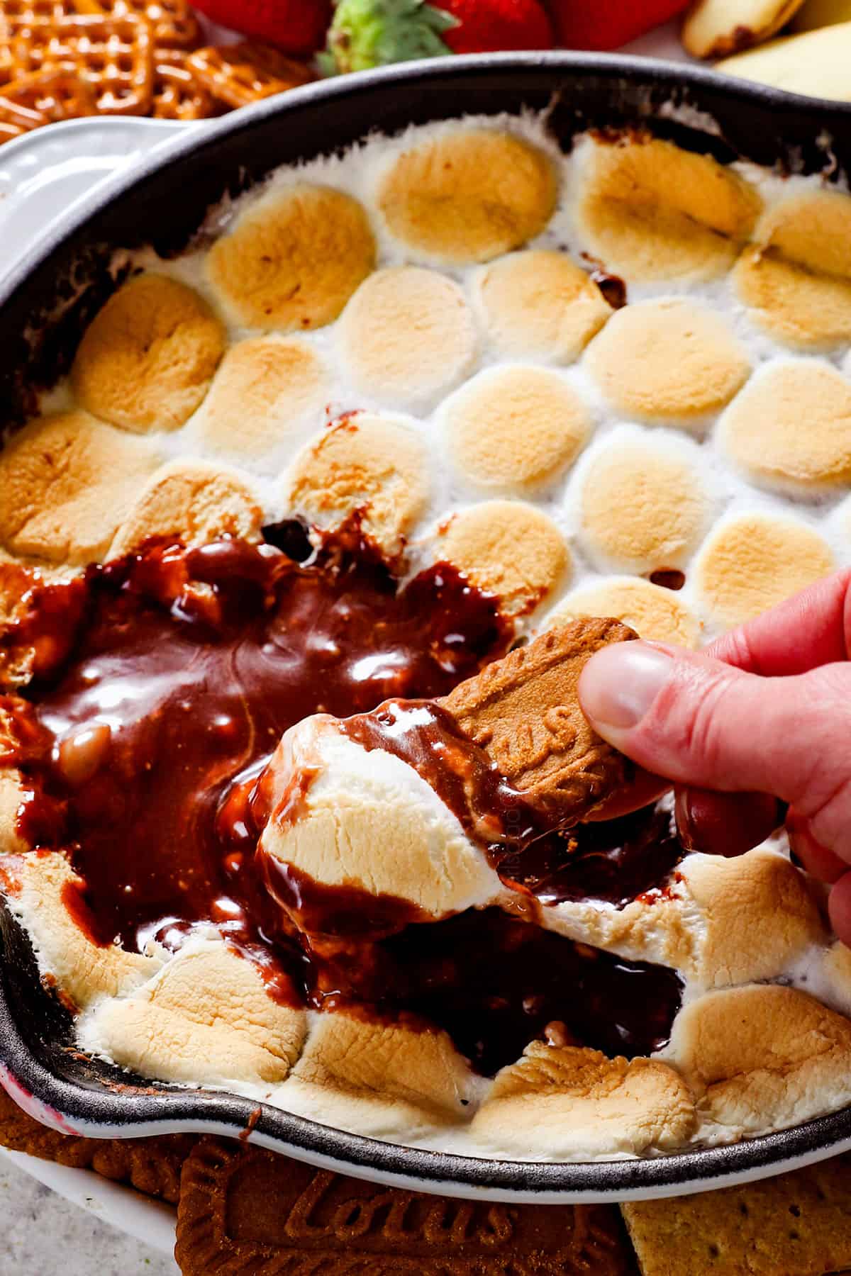 s'mores dip made with milk chocolate chips and marshmallows in a skillet