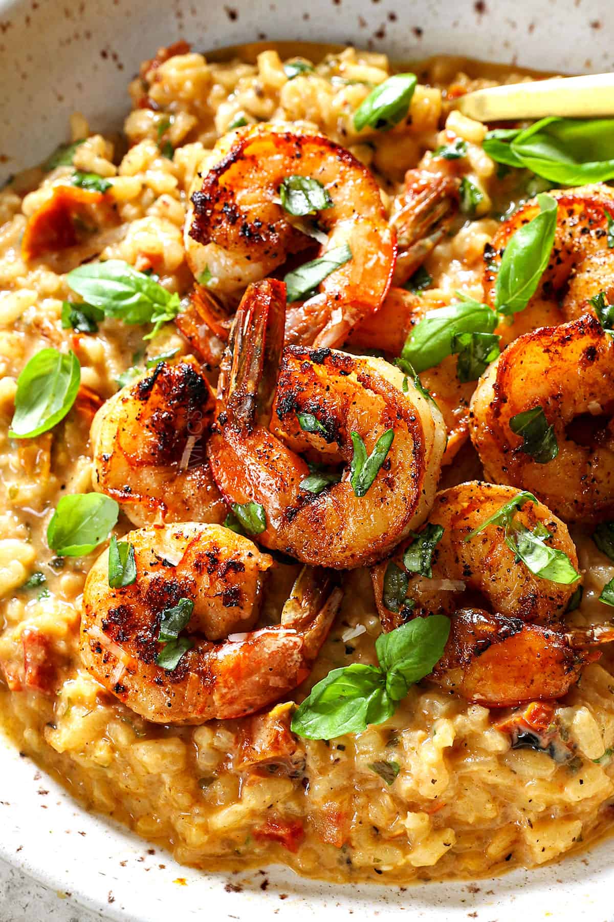 serving Italian shrimp risotto with creamy risotto and sautéed shrimp