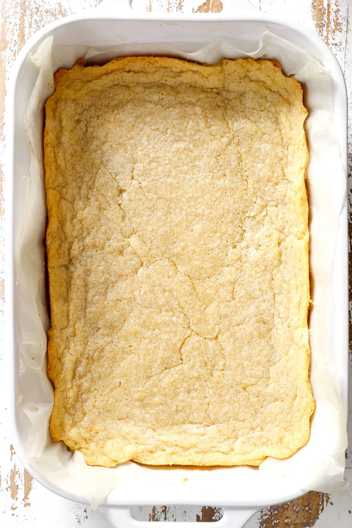 showing how to make sugar cookie bars by baking until just golden around the edges