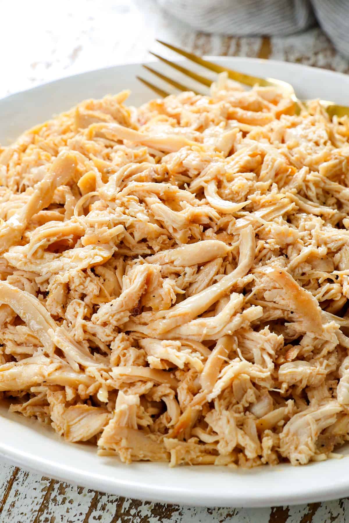 up close of shredded chicken recipe showing how tender and juicy it is