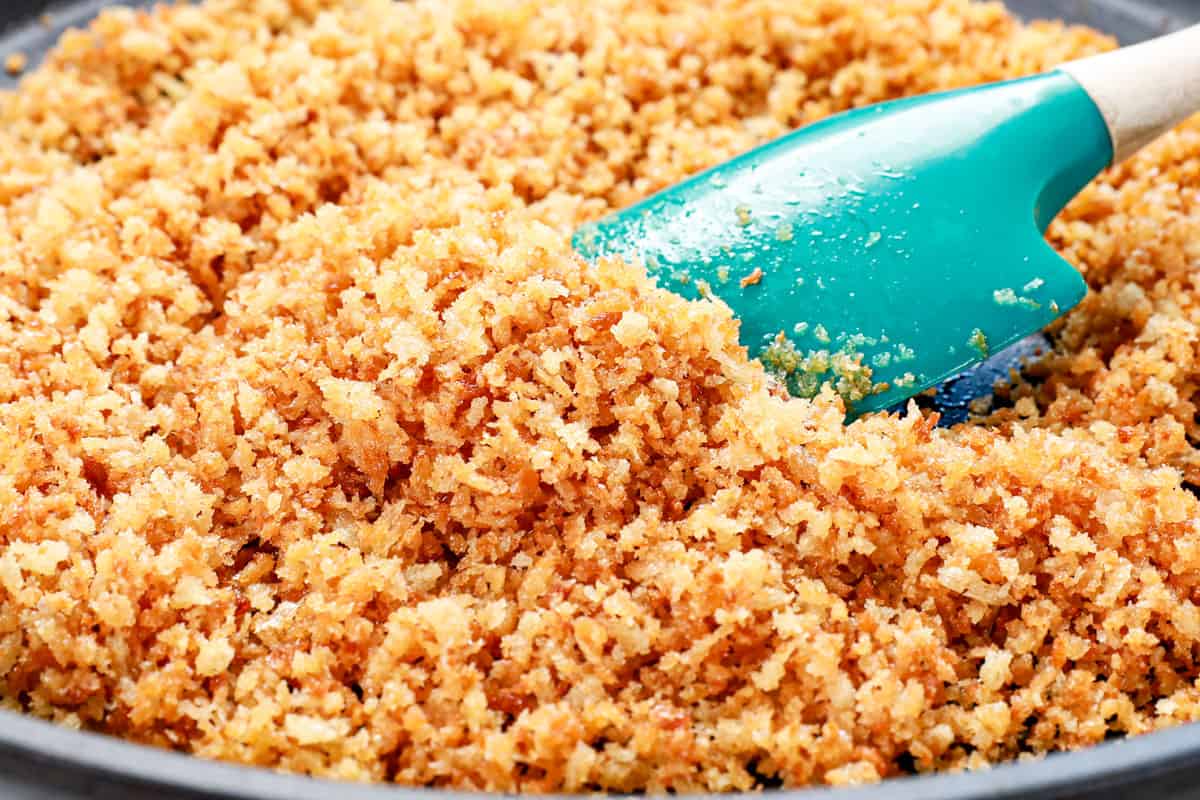 showing how to make chicken cordon bleu recipe by toasting the panko breadcrumbs in a skillet