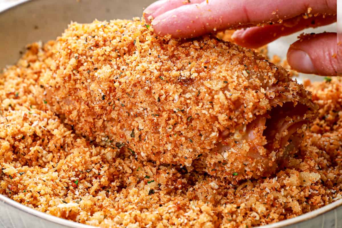 howing how to make chicken cordon bleu recipe by breading the chicken with panko breadcrumbs and Parmesan 