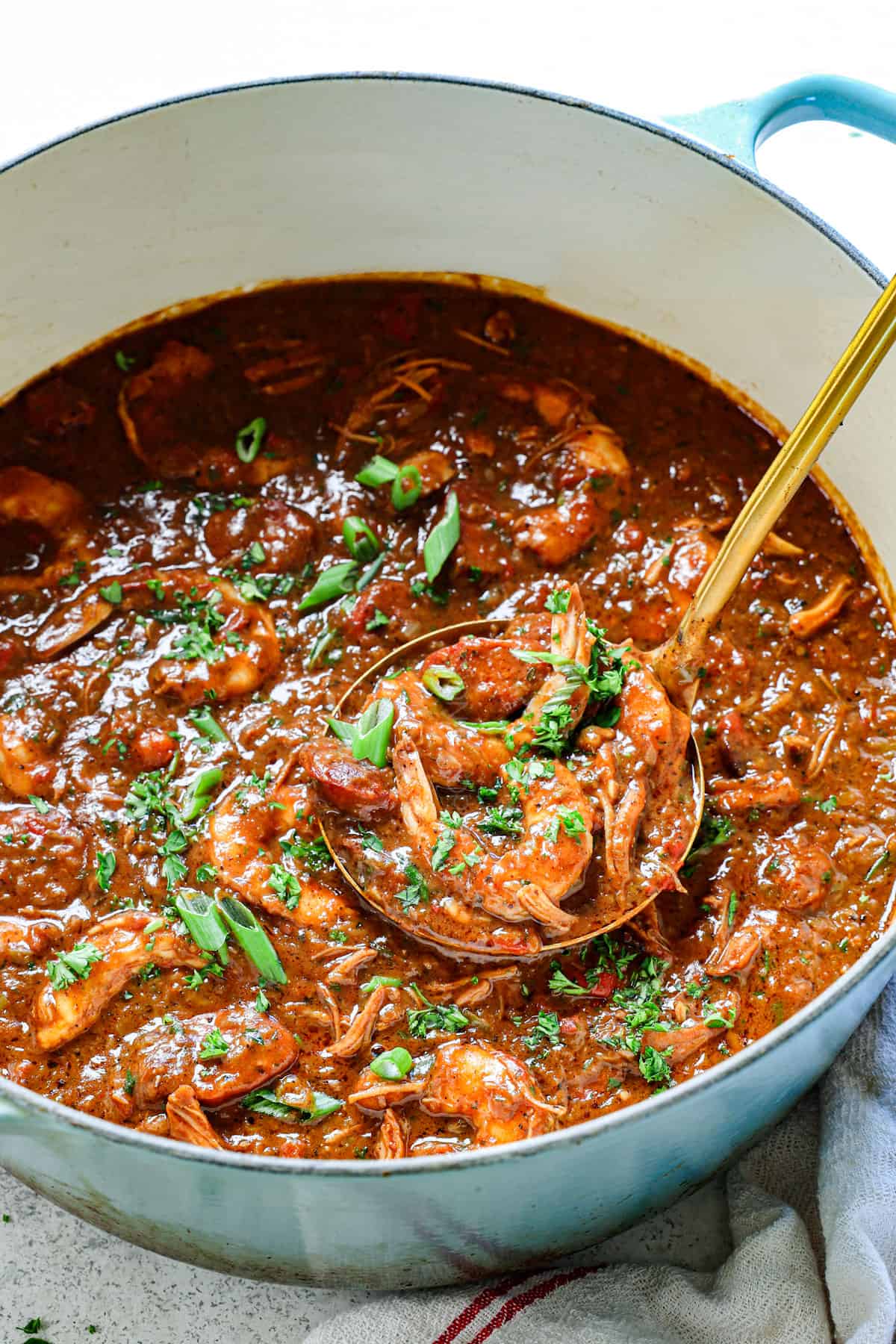 serving chicken and sausage gumbo recipe in a pot 