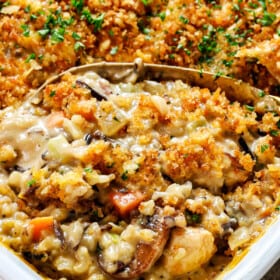 up close of serving chicken wild rice casserole showing how creamy it is