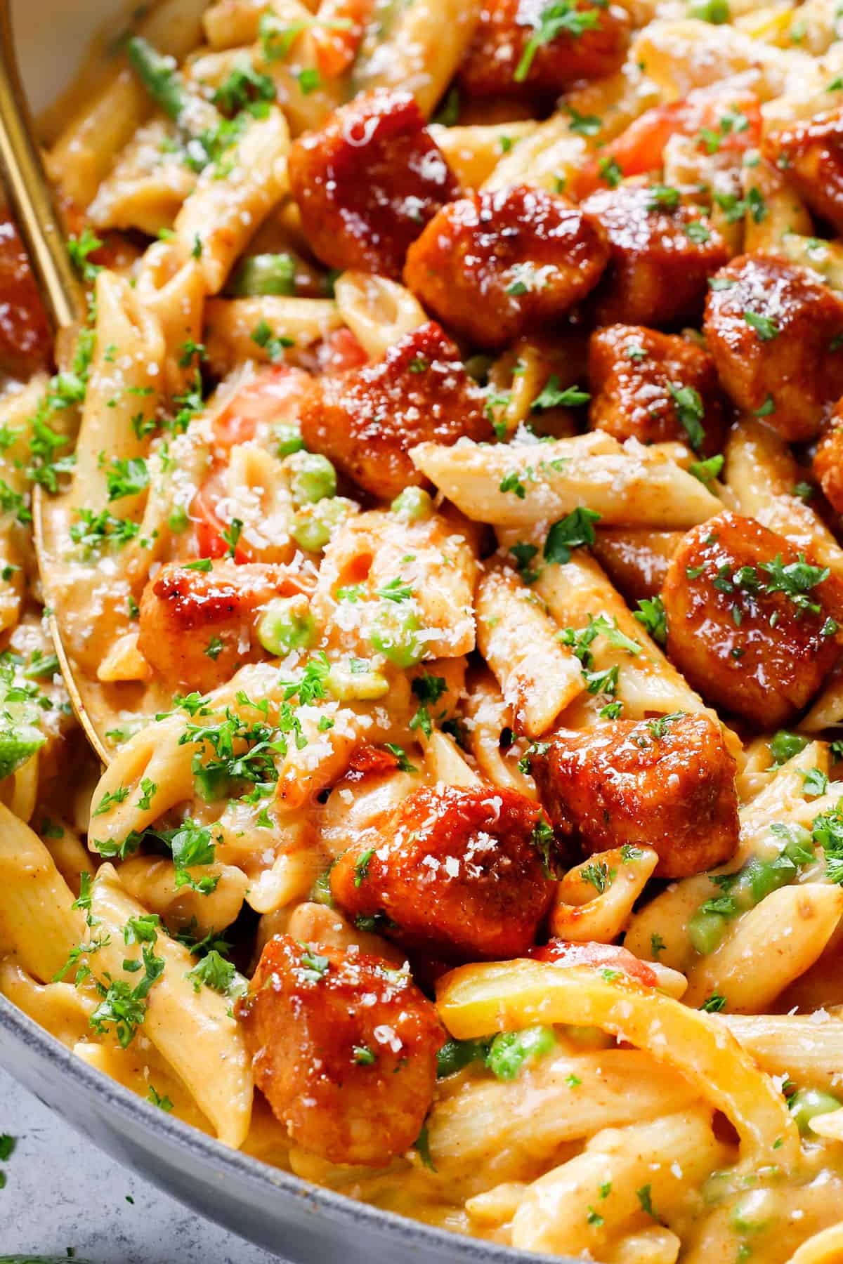 up close of serving spicy chicken pasta with chipotle chicken showing how creamy it is