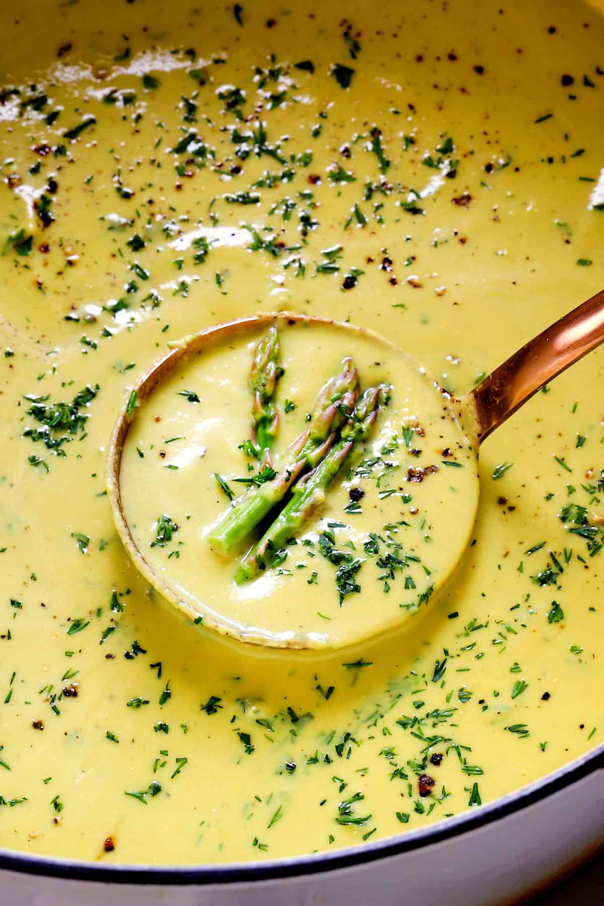 up close of a pot of asparagus soup recipe showing how creamy it is without heavy cream