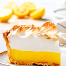 a slice of Lemon Meringue Pie on a plate showing how fluffy the meringue is
