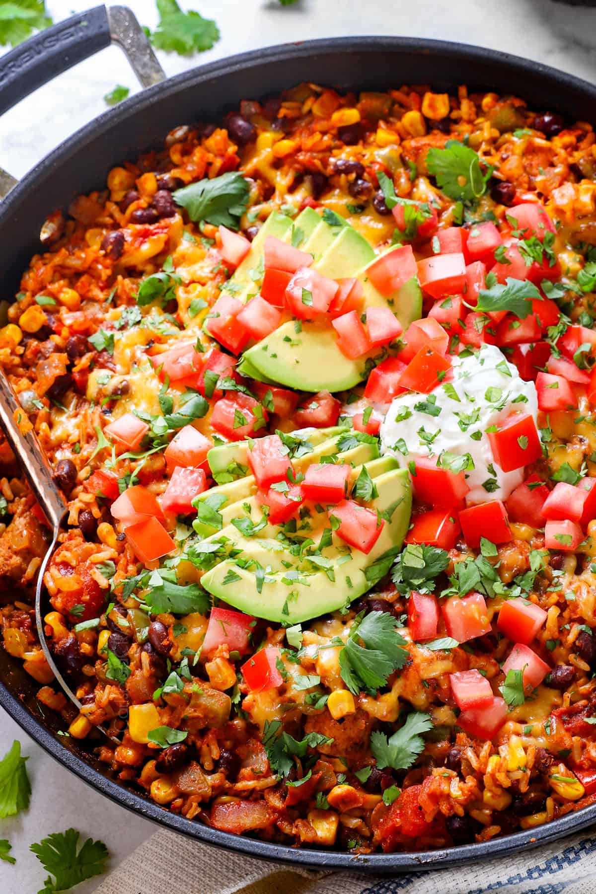 Fiesta chicken with chicken, rice, beans, corn and tomatoes all simmered together in one skillet
