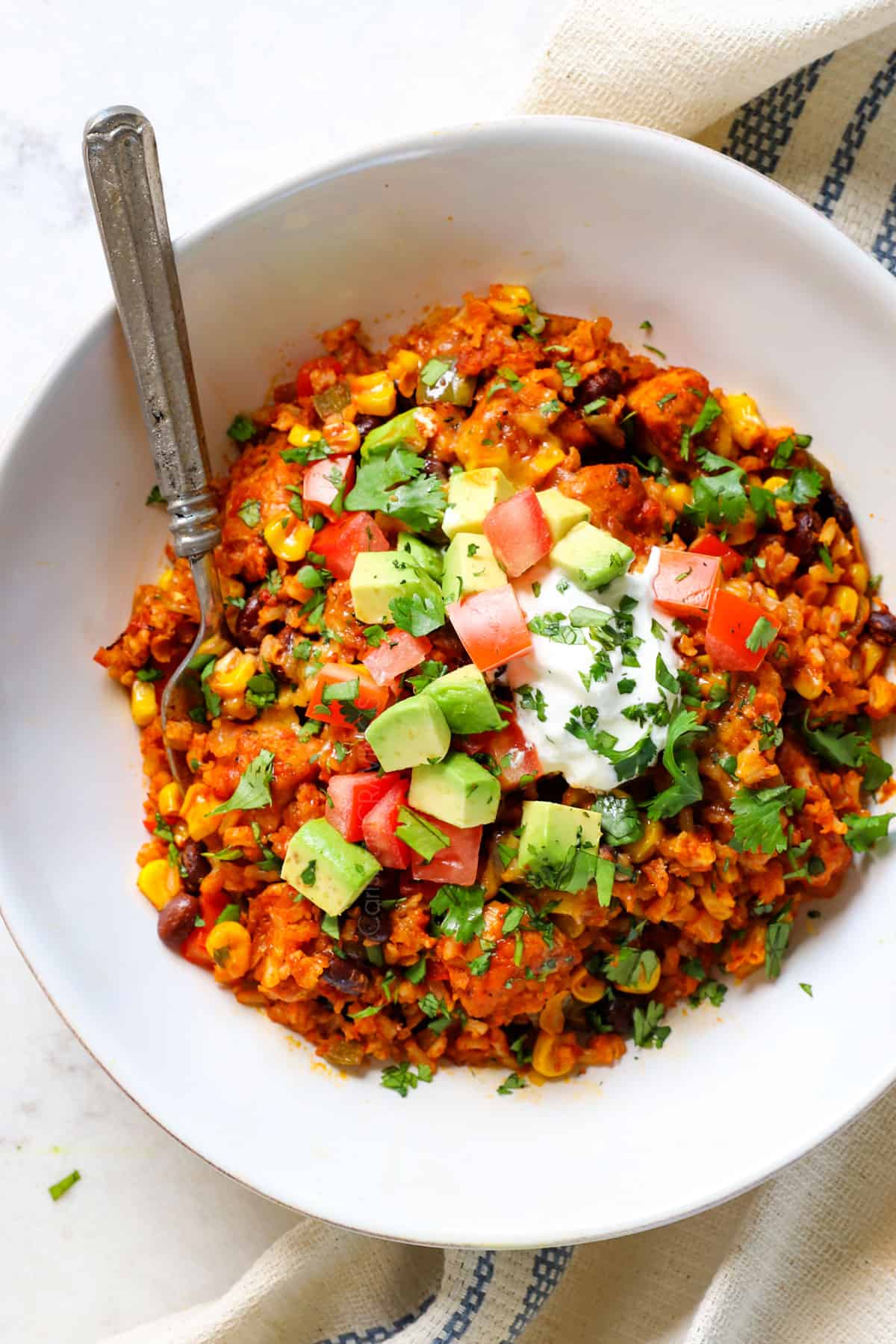 serving chicken fiesta recipe in a bowl with rice