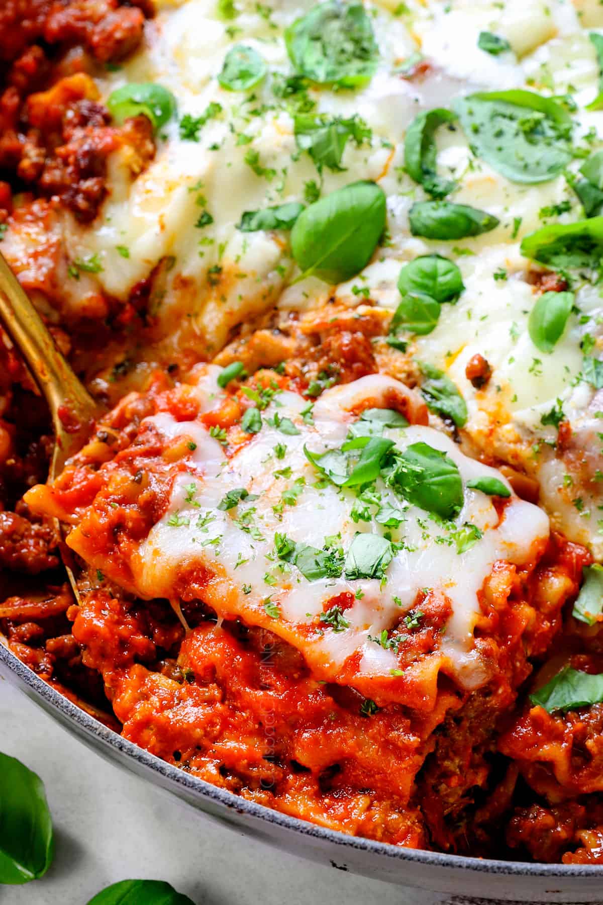 up close or skillet lasagna recipe showing how cheesy it is