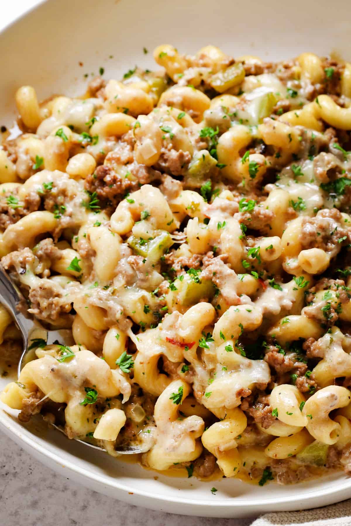 showing how to serve Philly Cheesesteak Pasta in a bowl
