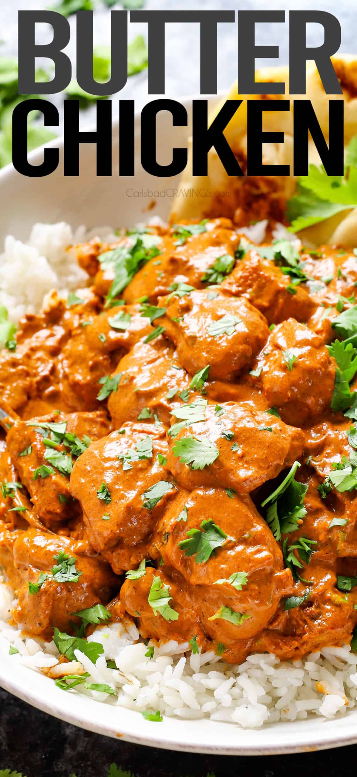 Up close of Indian Butter Chicken with rice showing how saucy it is
