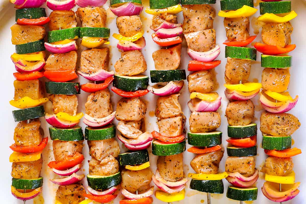 a collage showing how to make oven chicken kabobs (chicken kebabs) by threading chicken and vegetables onto skewers 