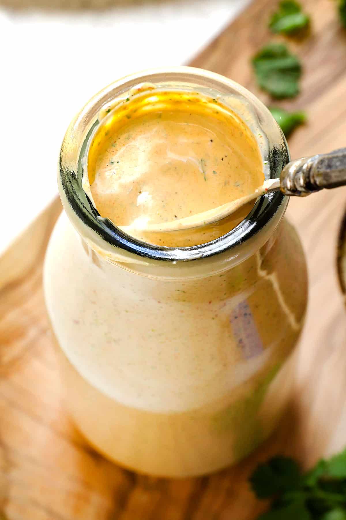 serving chipotle salad dressing recipe in a glass bottle