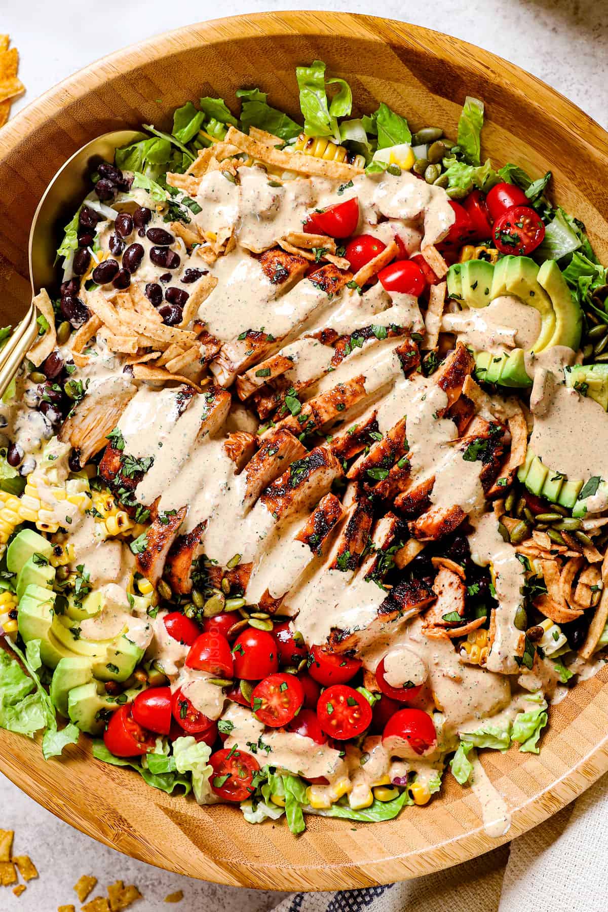 top view of Southwest Chicken Salad recipe drizzled with dressing