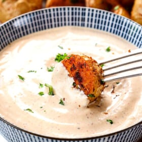 showing how to serve remoulade by dipping potatoes in the sauce