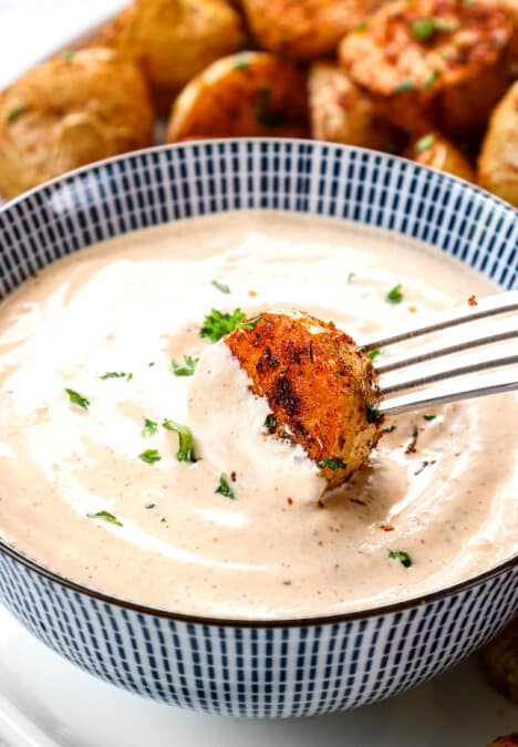 showing how to serve remoulade by dipping potatoes in the sauce