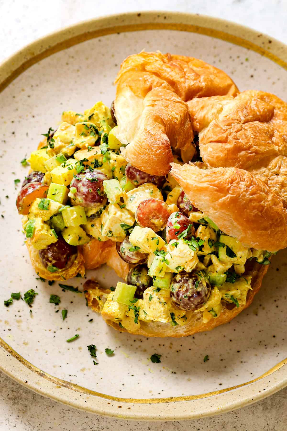 serving curry chicken salad as a croissant sandwich
