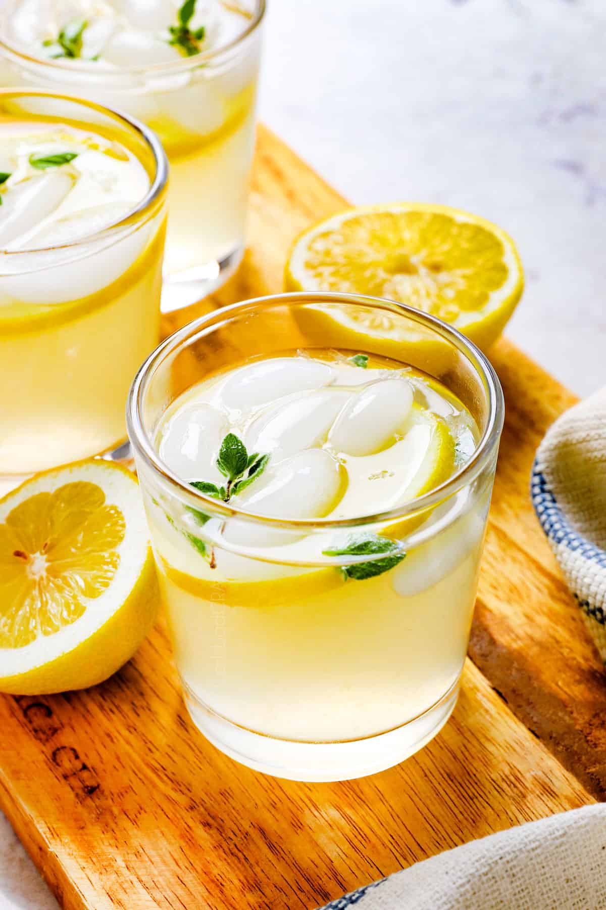 showing how to serve homemade lemonade in a glass with ice