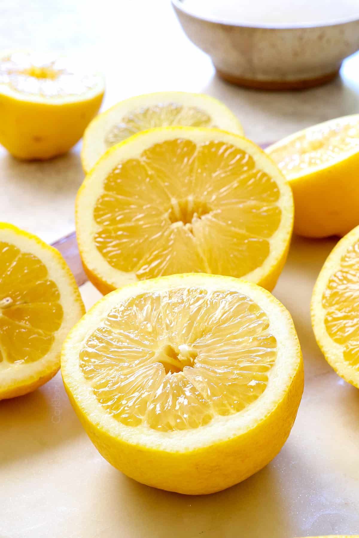 showing ingredients for lemonade:  lemons, water and sugar