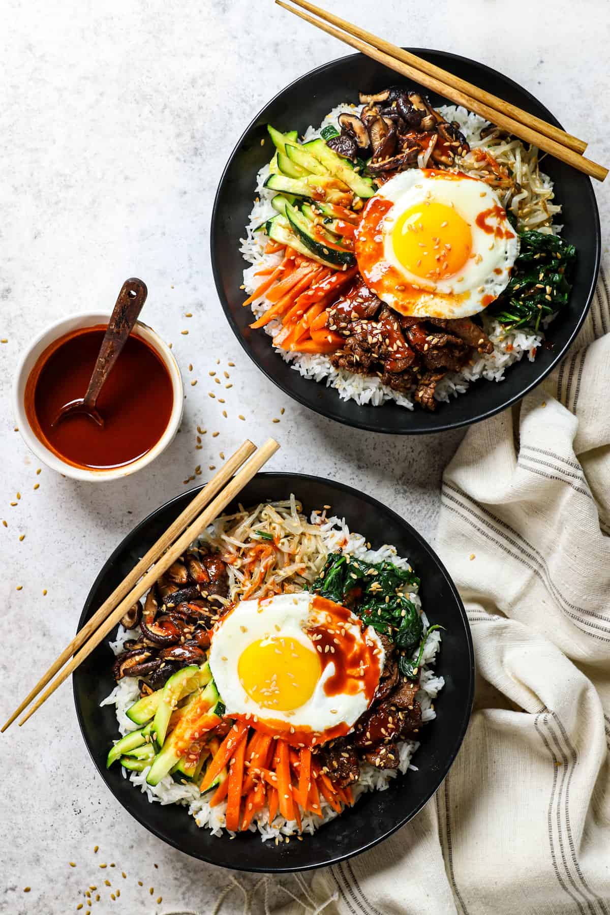 top view of Korean Bibimbap being served in two bowls 