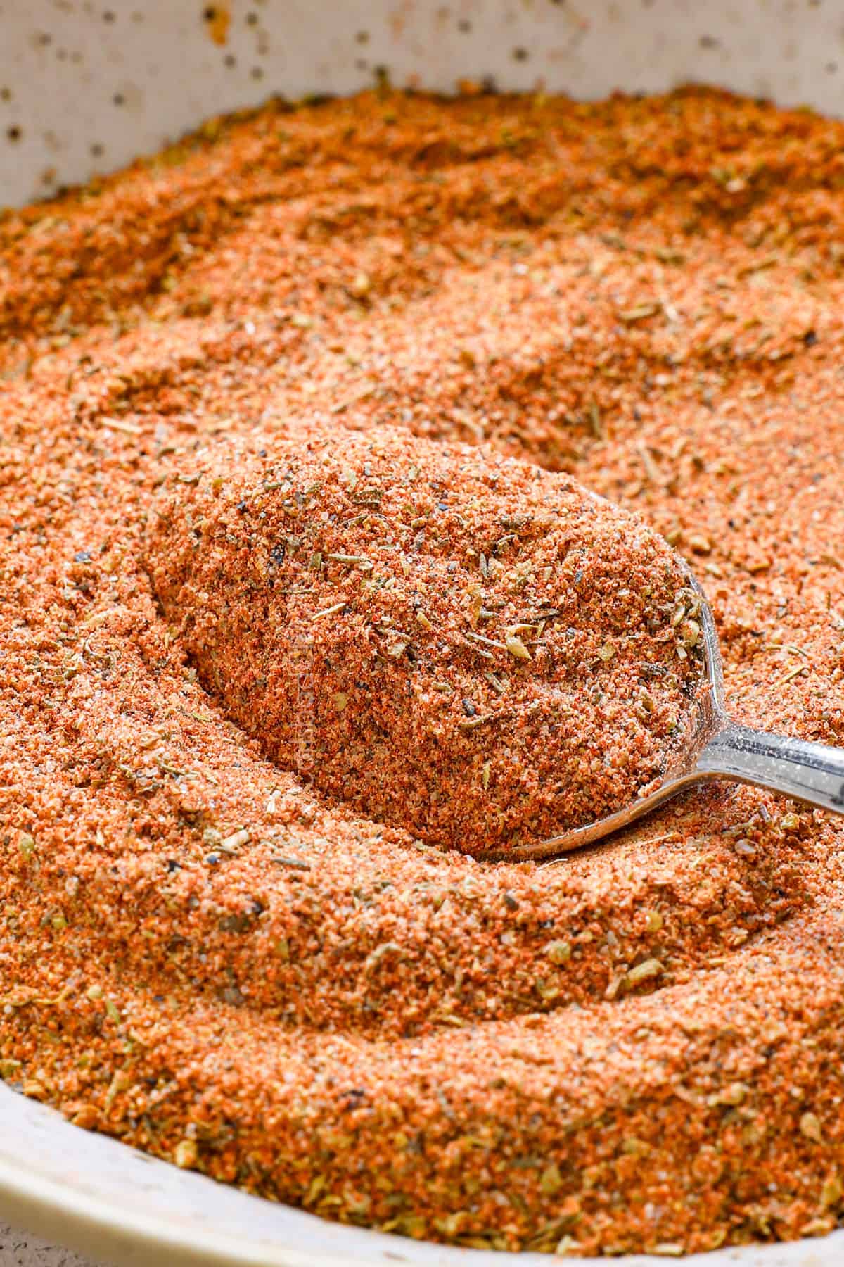 showing how to make Cajun seasoning by stirring together
