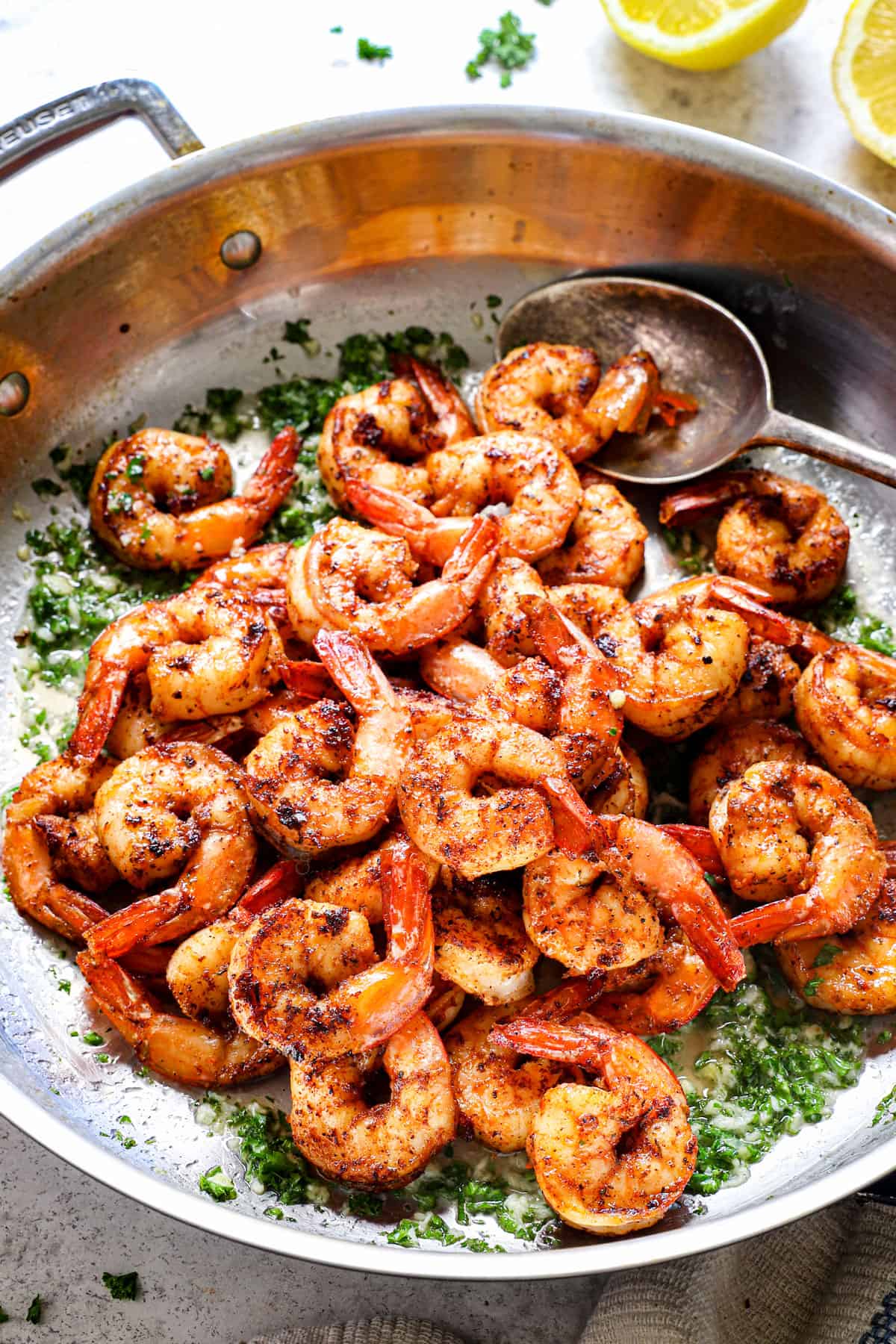 Cajun style shrimp being cooked in a skillet