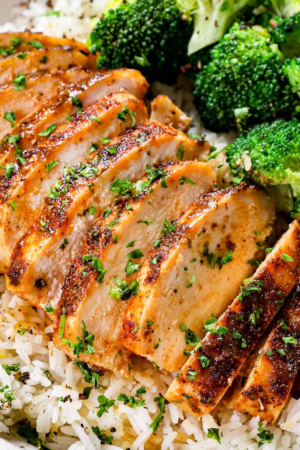 showing how to serve baked chicken breast in oven in a bowl with rice and broccoli